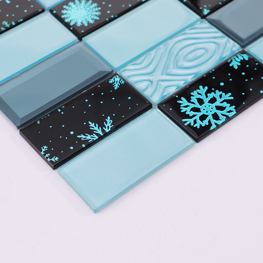 Detailed texture view of blue and black crystal glass tile with snowflake motif.