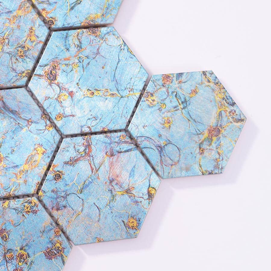 Close up of blue gold abstract hexagon aluminum mosaic tile edge detail