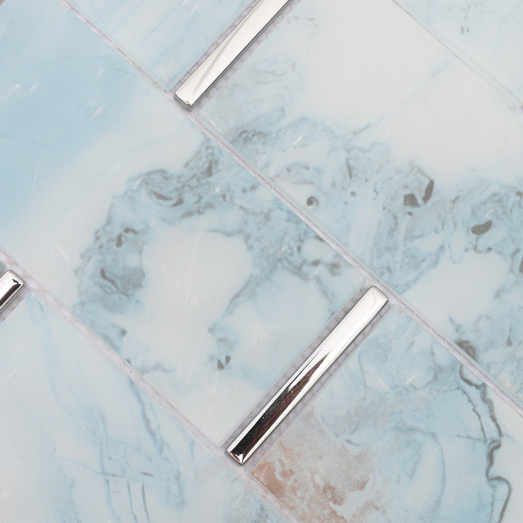 Close-up of blue gray glass subway mosaic tiles and electroplated glass strips
