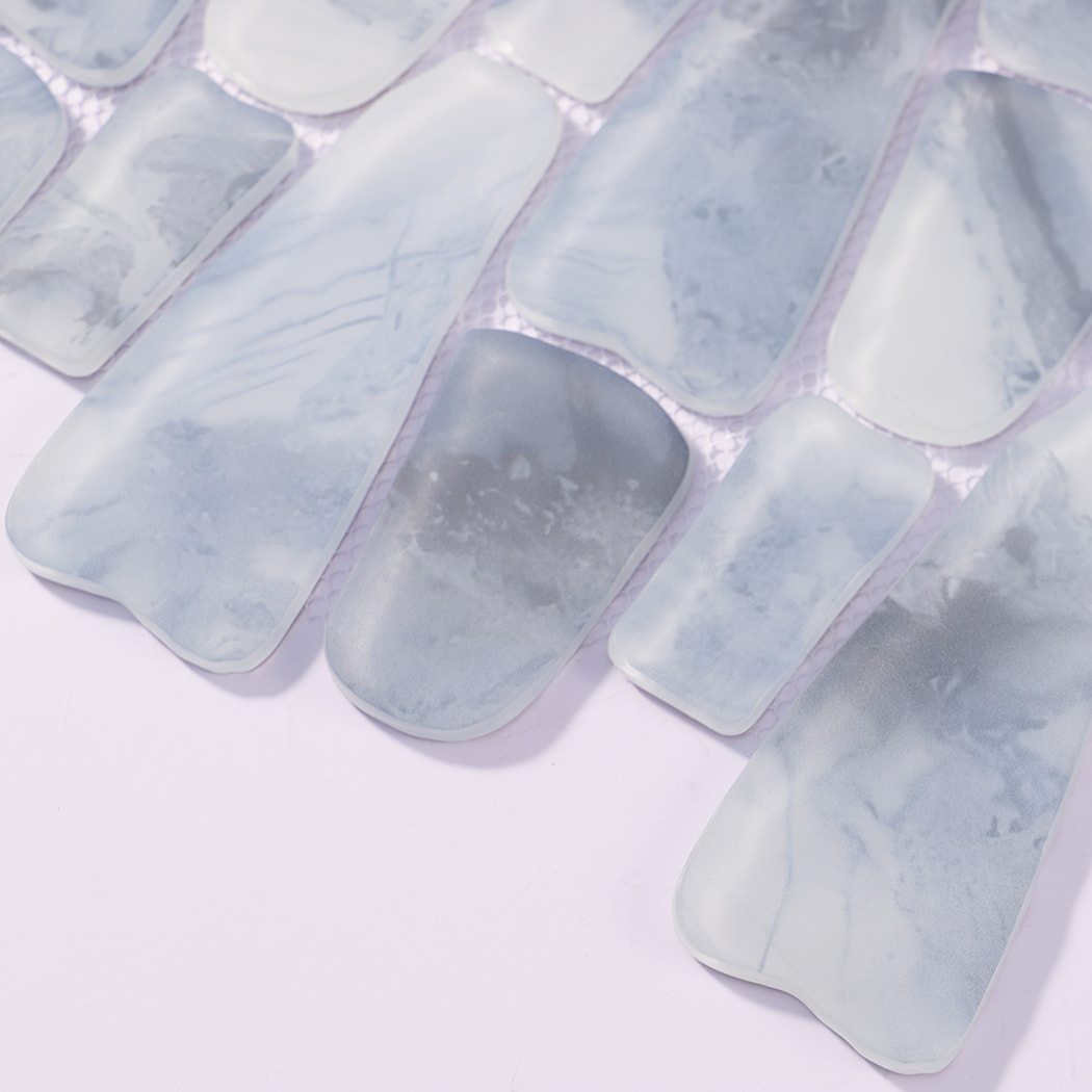 Close-up of mixed blue gray irregular pebble glass mosaic tile pieces