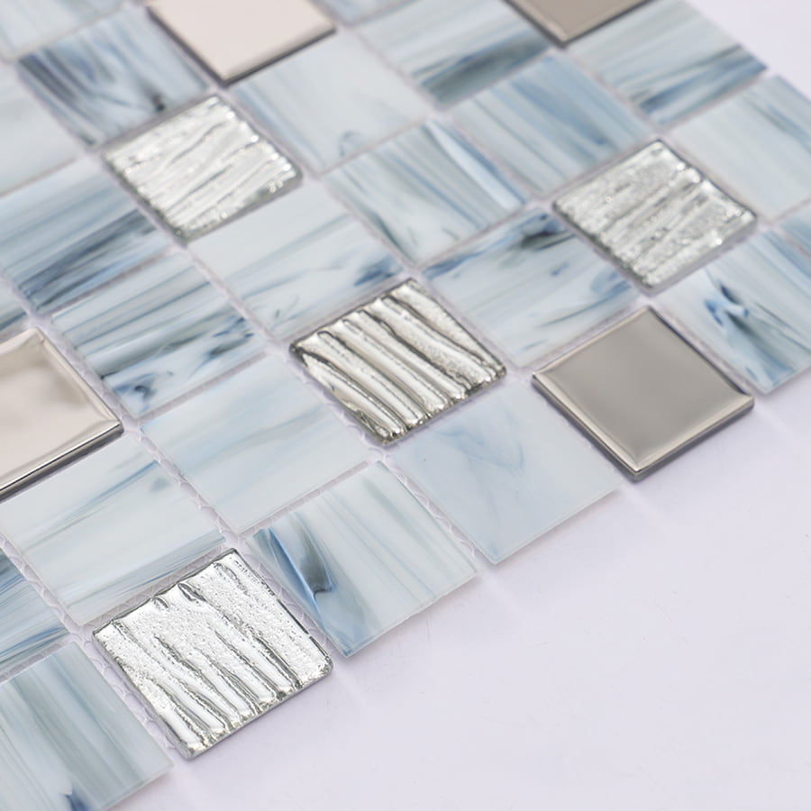 Angled view of mosaic tile sheet with blue gray and silver finishes