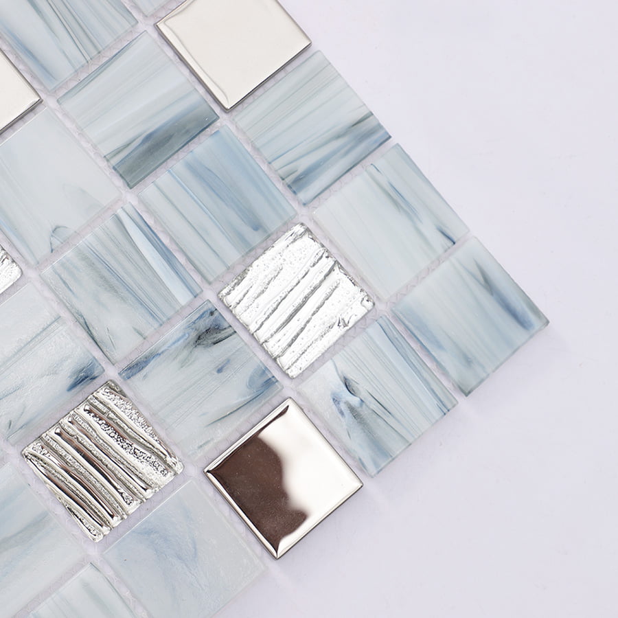 Close up of corner showing glossy and textured blue gray mosaic tiles