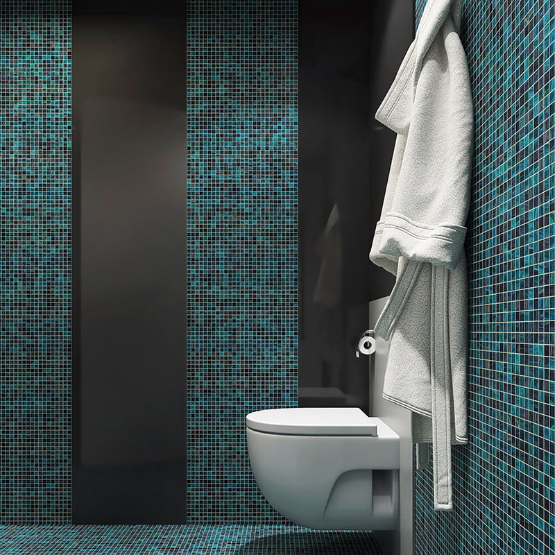 Glass mosaic tiles in blue green tones used for bathroom walls 