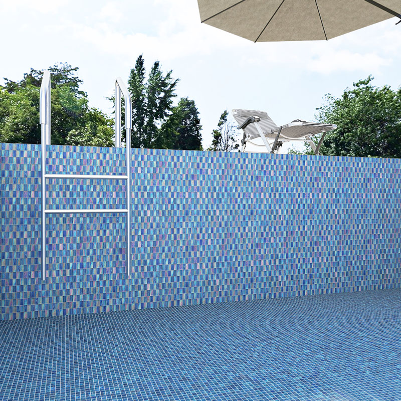 Blue iridescent glass mosaic pool wall and floor with patio umbrella