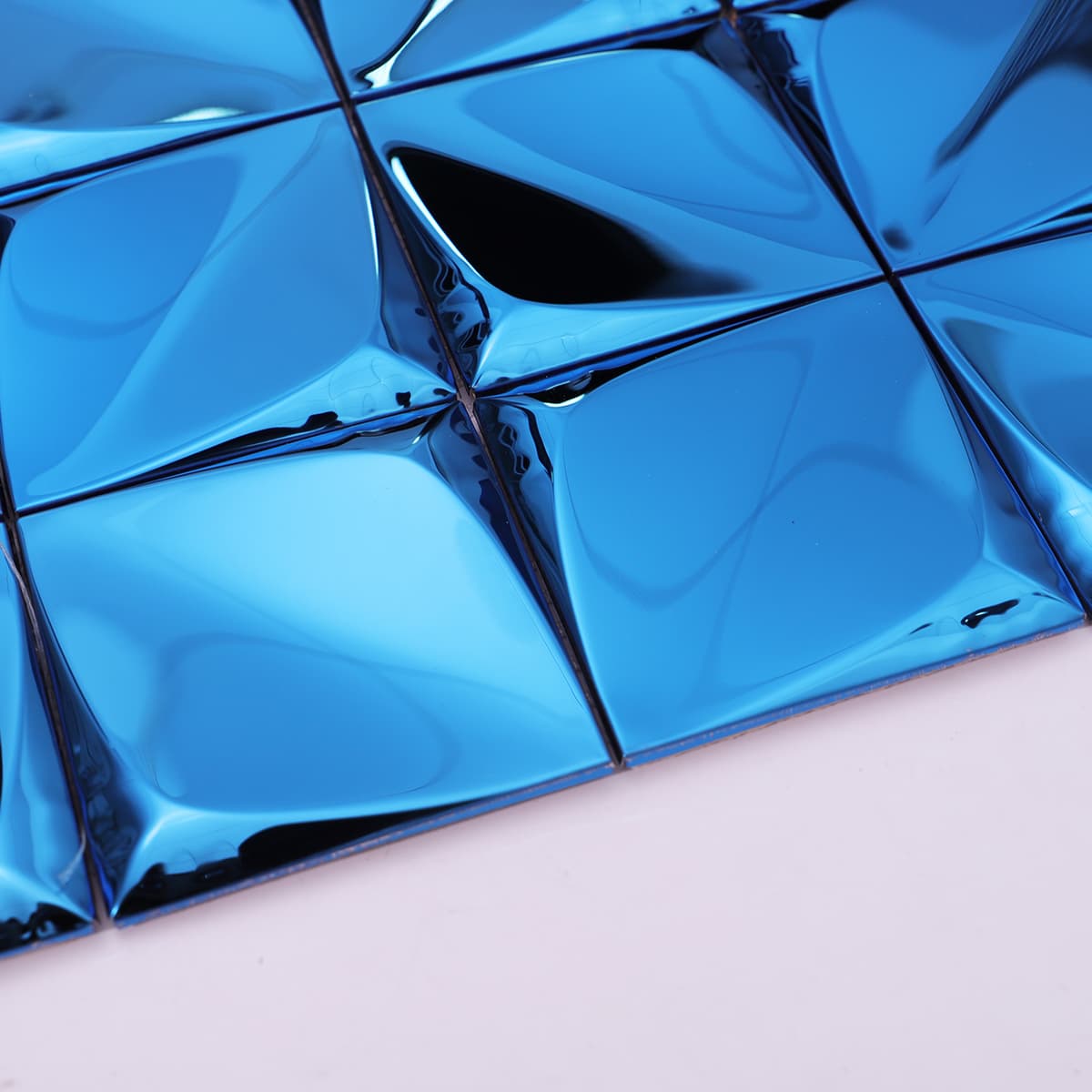 close-up of blue 3D metal pyramid mosaic with smooth tile transitions