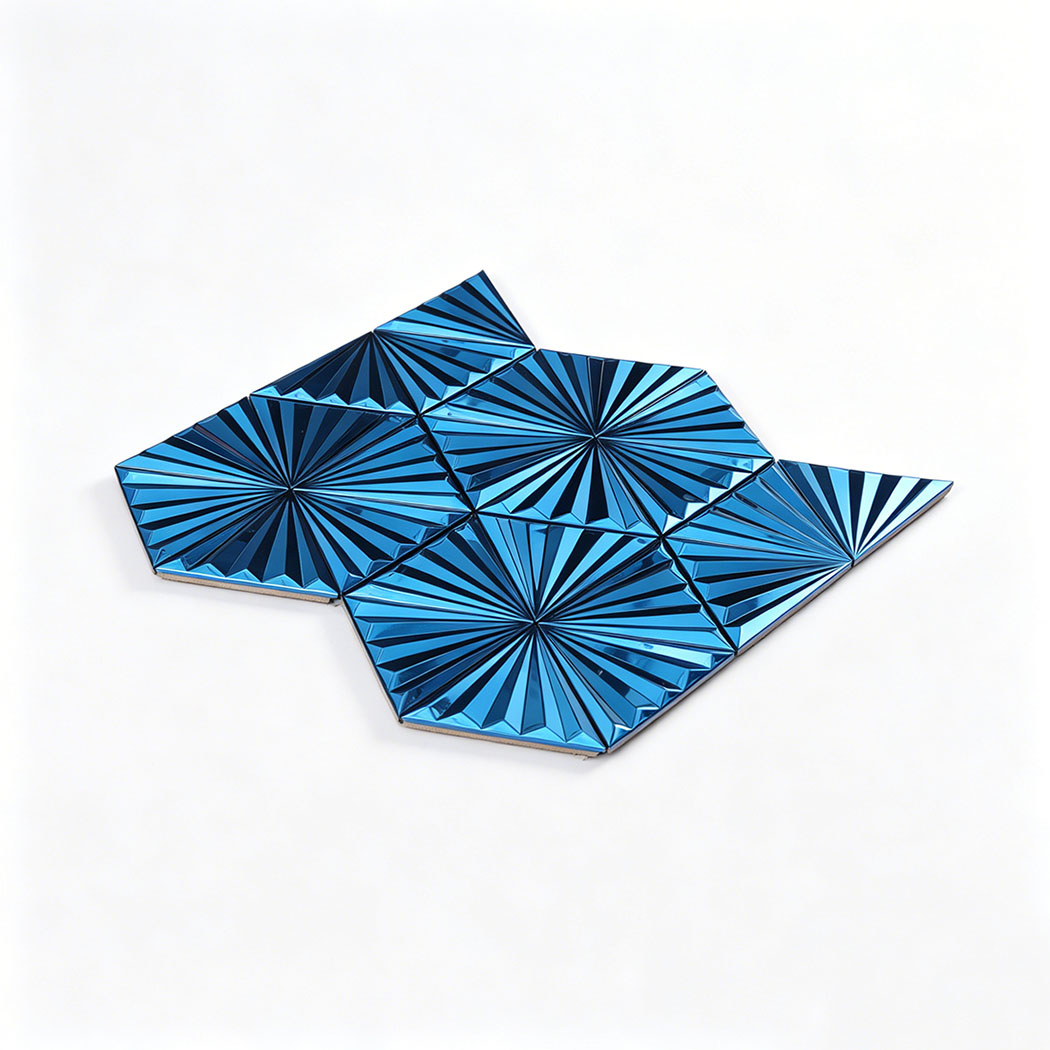 Angled view of blue raised triangle metal mosaic tile sheet with fan pattern