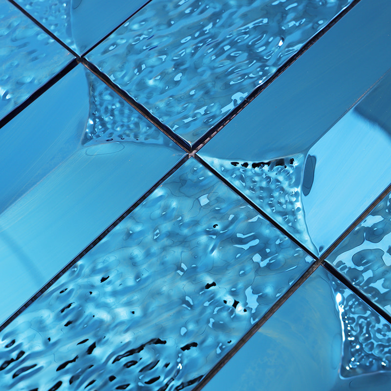 Blue mirrored metal mosaic tiles with ripple and smooth surface contrast