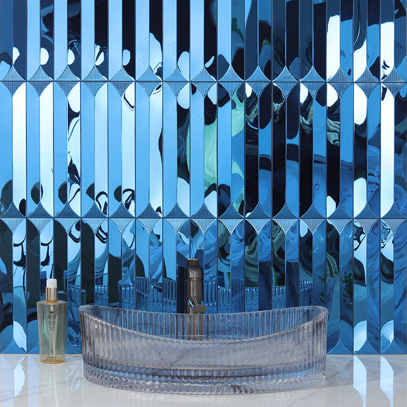 Blue textured mirror glass mosaic tiles reflecting light for wall backsplash.