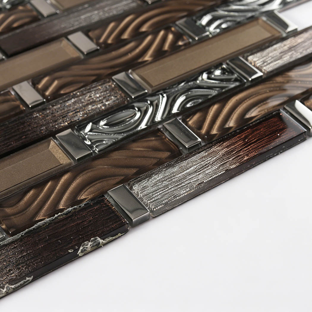Side view of bronze gray glass linear mosaic showing flat strip thickness and layered texture
