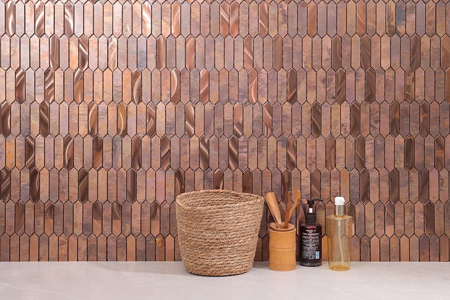 Bronze picket tile backsplash with mixed matte and glossy finishes