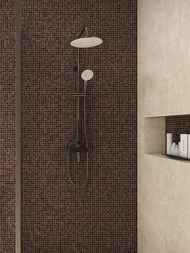 Small brown mosaic tiles in a modern walk-in shower space