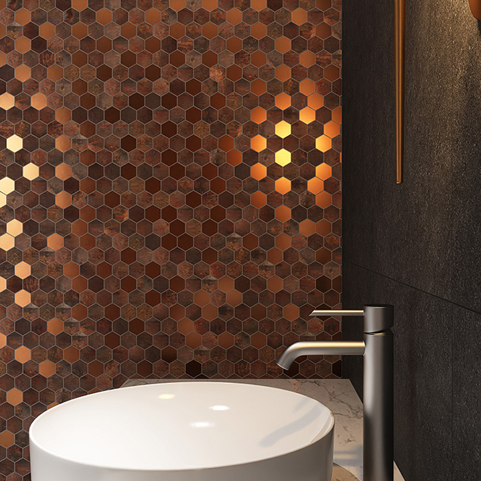 Obverse side of hexagon brown copper mosaic tiles on bathroom wall.