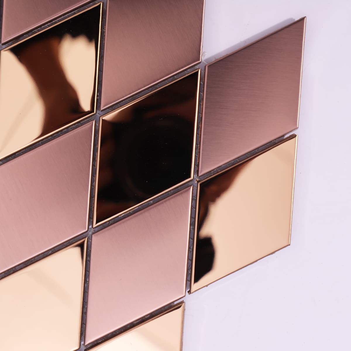 Angled view showing texture of rose gold diamond mosaic