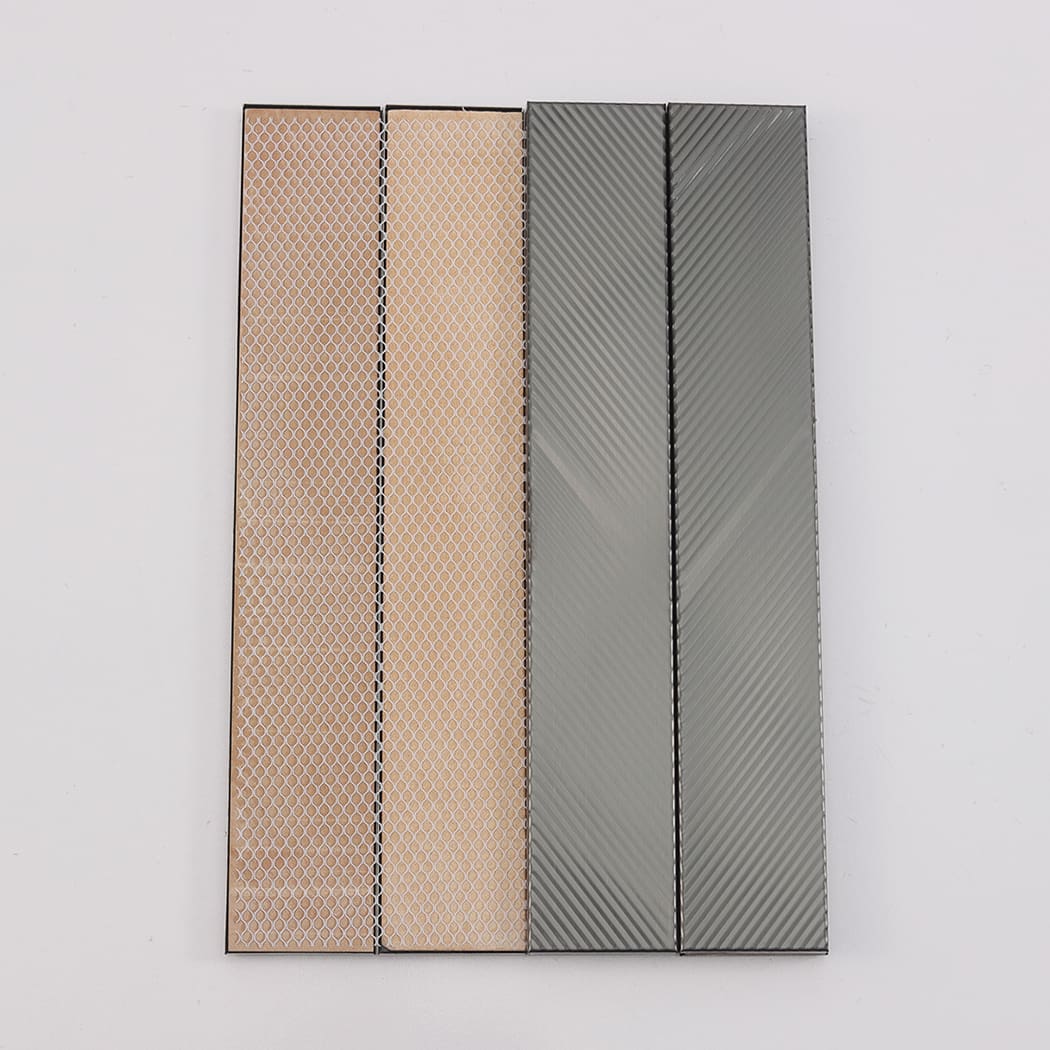 Sample view of brushed black stainless steel tiles showing mesh backing structure