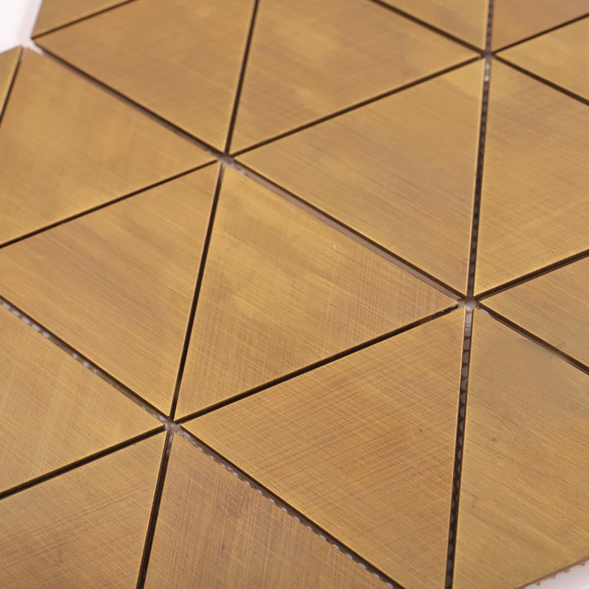 view of brushed triangle brass mosaic tile layout