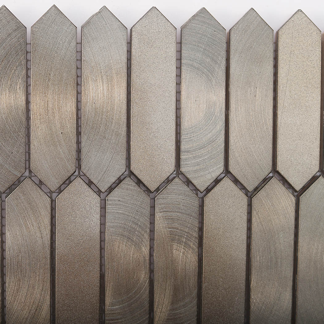 Macro texture of circular swirl pattern on brushed nickel tile