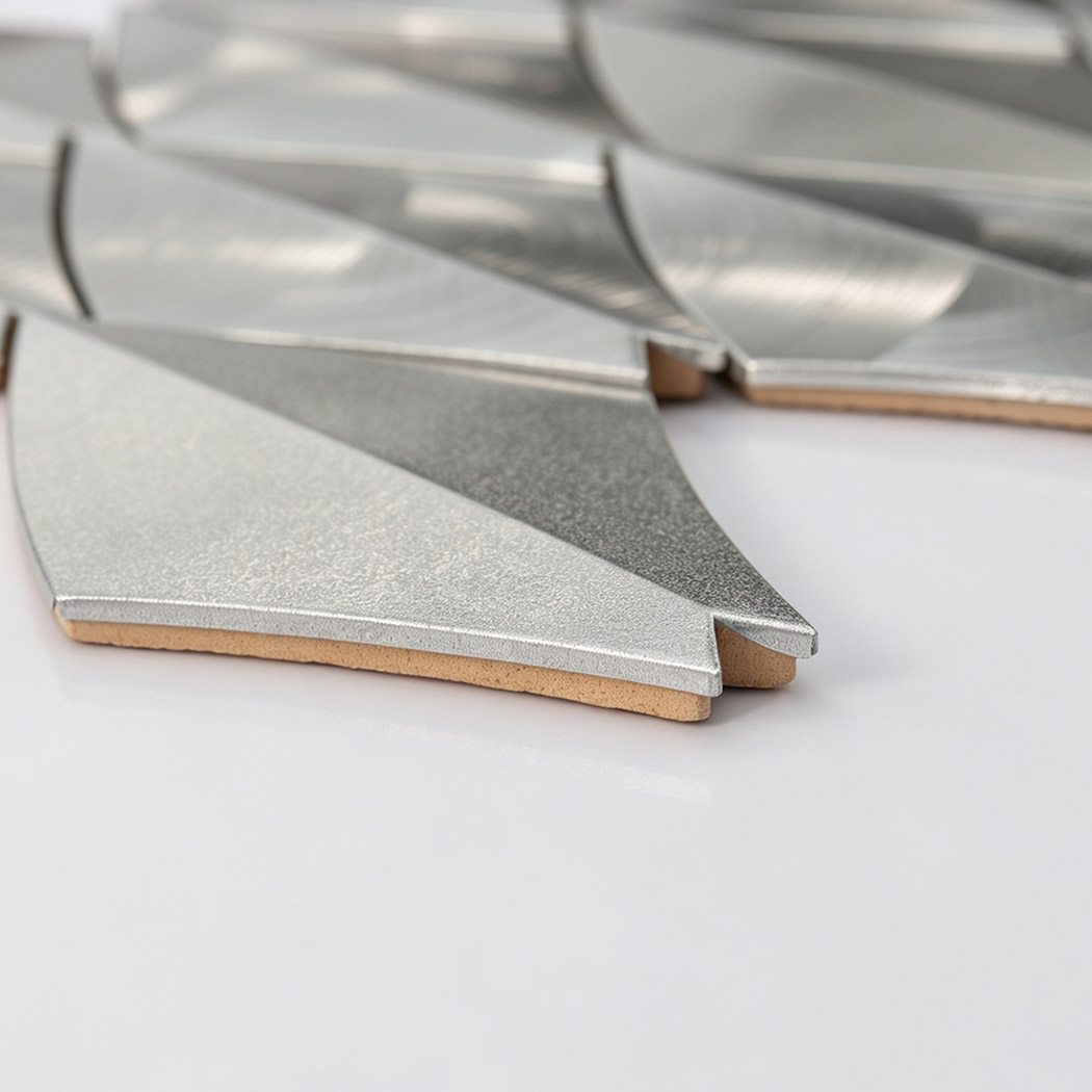 Angled perspective display of silver leaf shape aluminum tile
