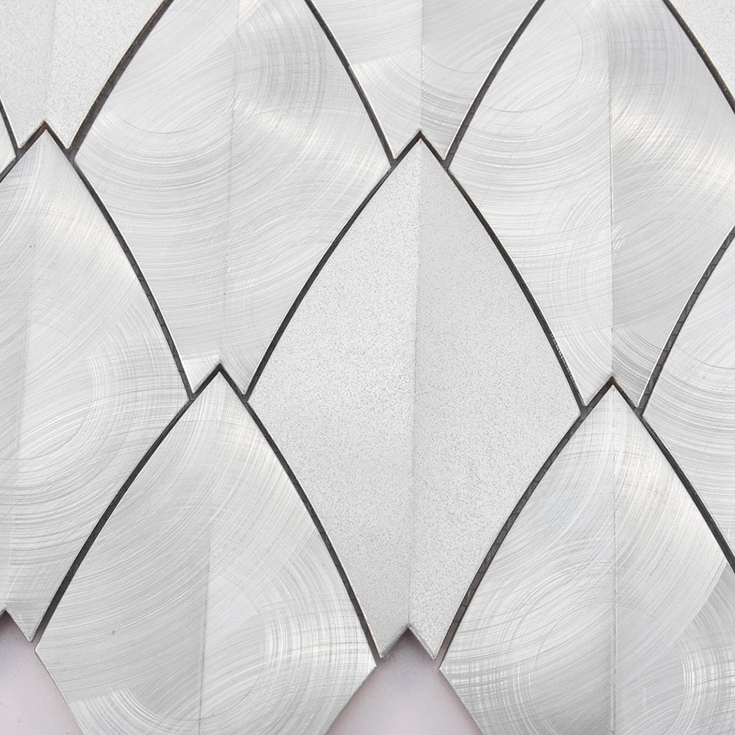 Close up of brushed texture on silver leaf shape aluminum tile