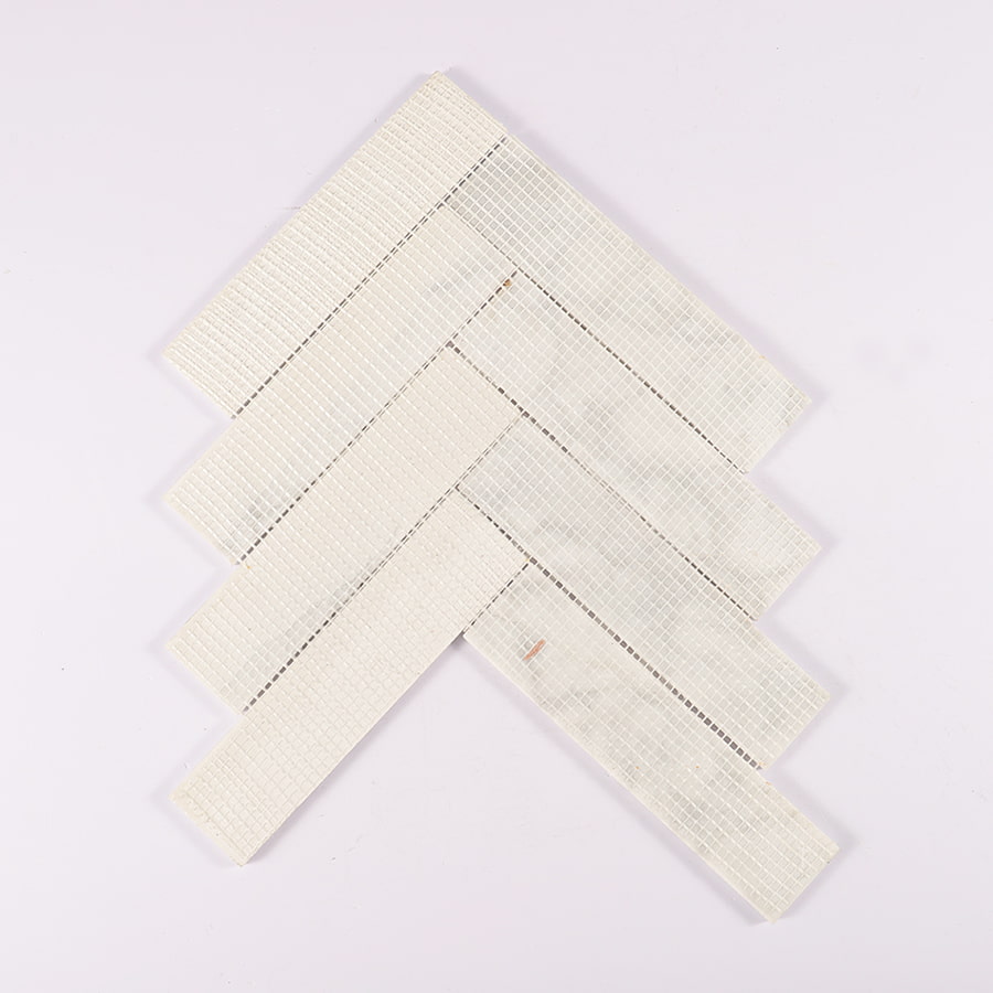 Back mesh view of Carrara white herringbone marble mosaic tile