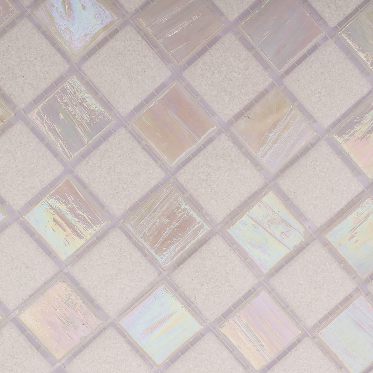 Detailed close-up of checkered white frosted and iridescent glass mosaic surface