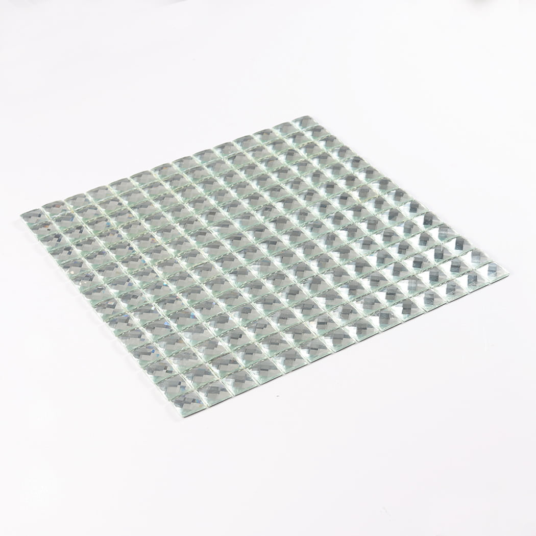 A full sheet of clear mirror square glass mosaic tile viewed from a tilted angle.