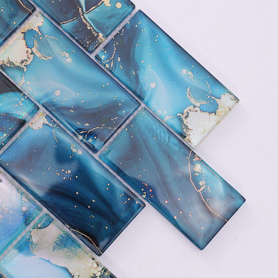 Close up of blue rectangular glass mosaic tiles showing glossy texture