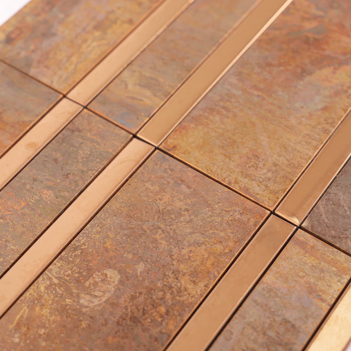 Rustic copper mosaic tile with shiny stainless steel strip details