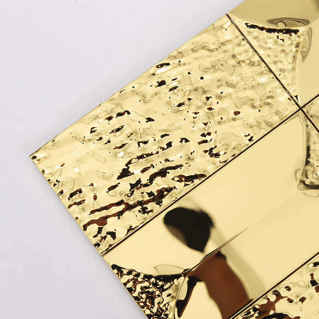 Close up of gold metallic tiles showing the ripple and smooth surface detail.