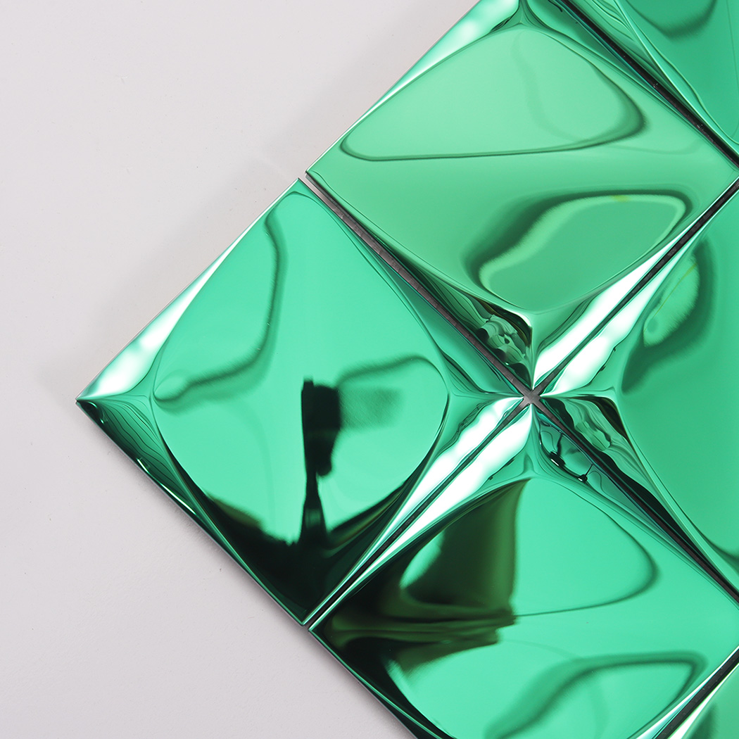Detailed close up of the corner and smooth metallic surface of a green 3D square tile.