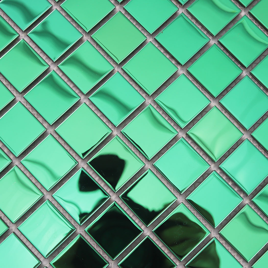Detailed macro shot of green 3D square metal tiles highlighting the mirror finish.