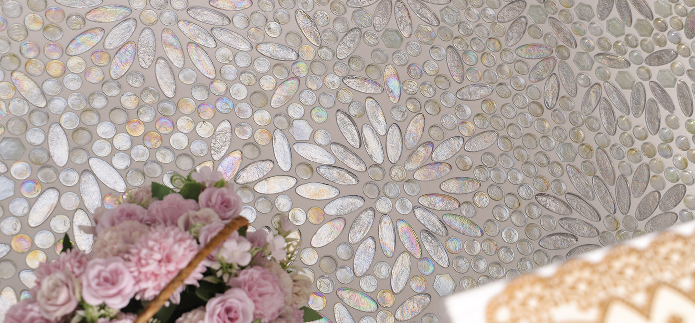  Close-up of shimmering iridescent floral mosaic glass tile design