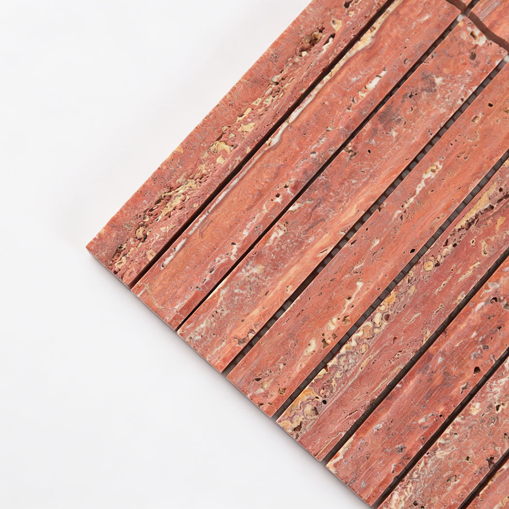 Close up corner view of red travertine linear mosaic tile with natural stone texture