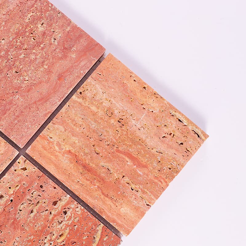 Close up of red travertine mosaic tile corner detail