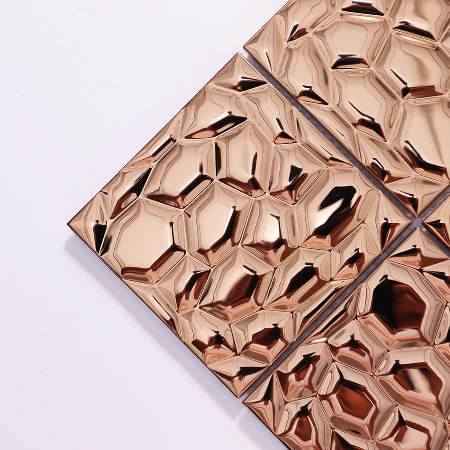 Close-up of rose gold stainless steel mosaic tile corner view
