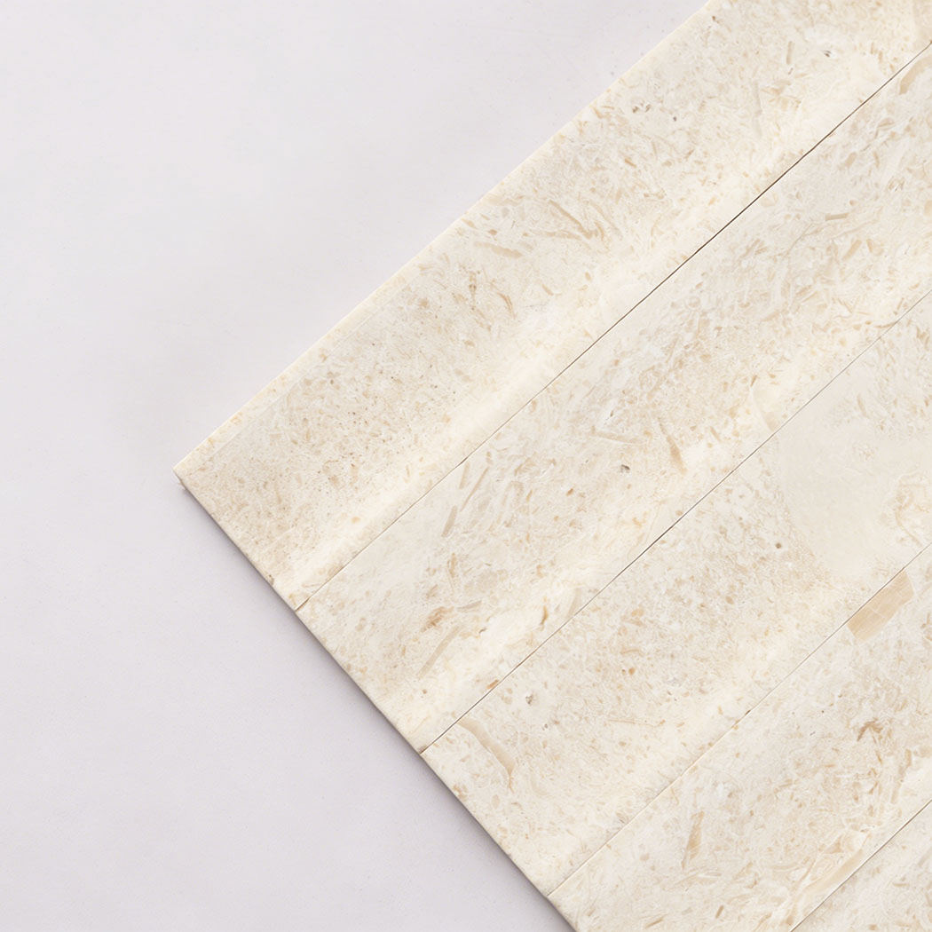 Close up corner of seamless limestone fluted mosaic tile with soft natural veins