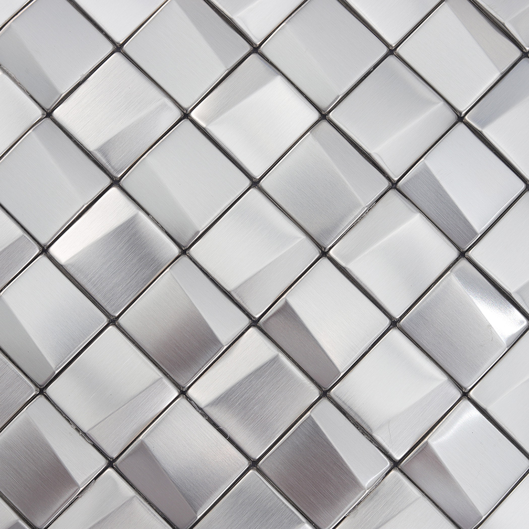 Macro shot detailing the textured brushed surface of small 3D silver metal tiles.