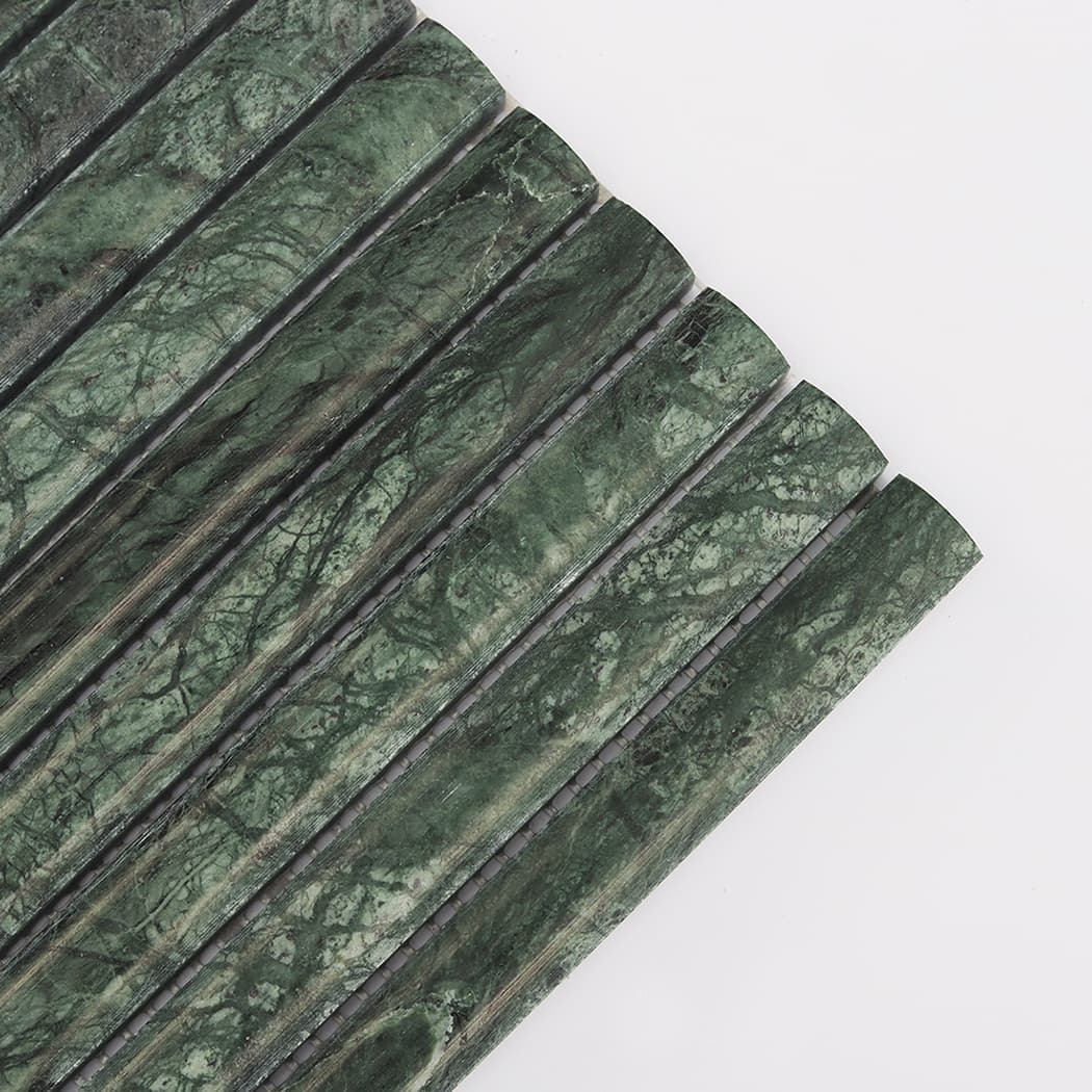 Detailed close-up showing the intricate dark green and black veins on marble mosaic strips.