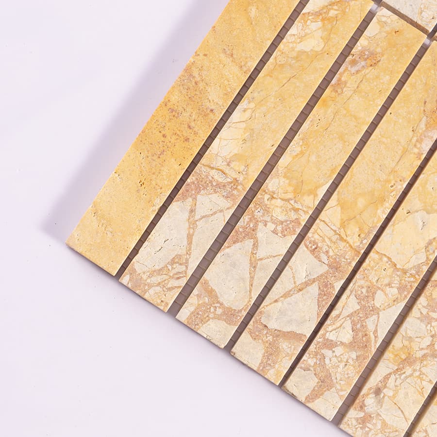 Close up of yellow marble strip mosaic tile corner detail