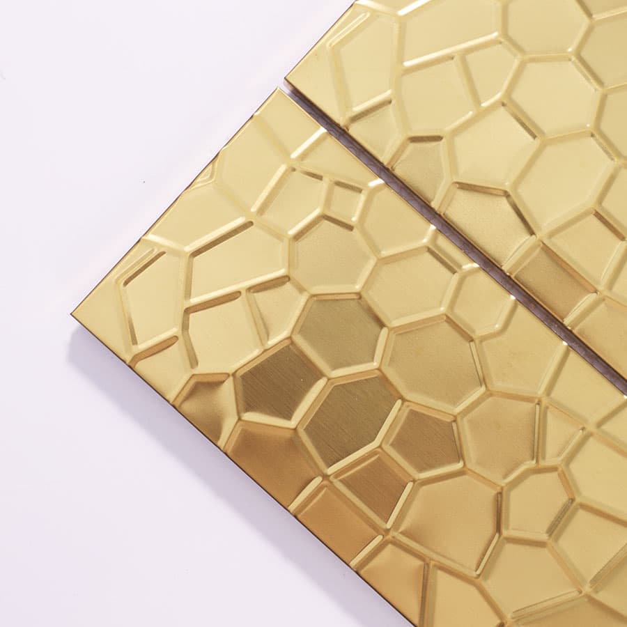 Close-up of gold rectangular stainless steel mosaic tile corner