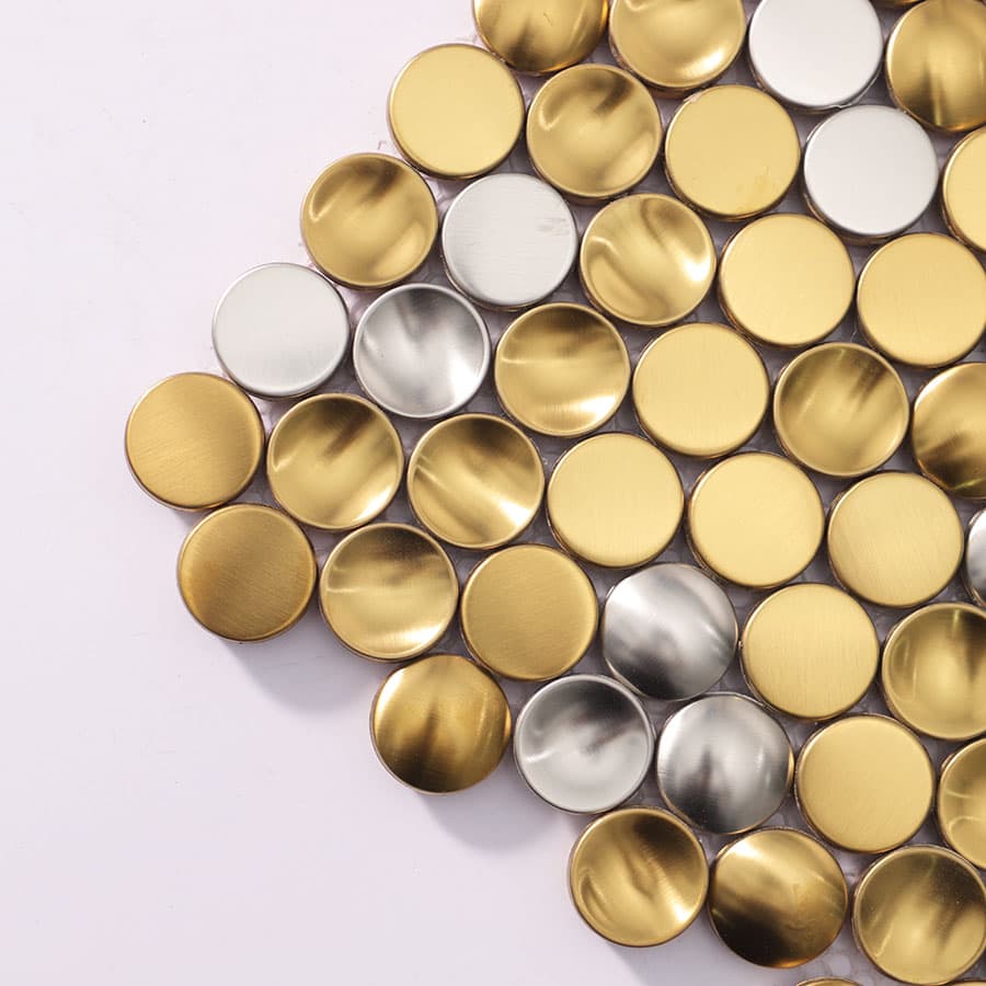 Close-up view of round gold and silver mosaic tiles