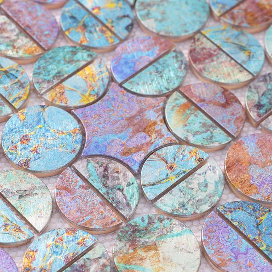 Close-up of surface texture and color contrast of round aluminum mosaic pieces