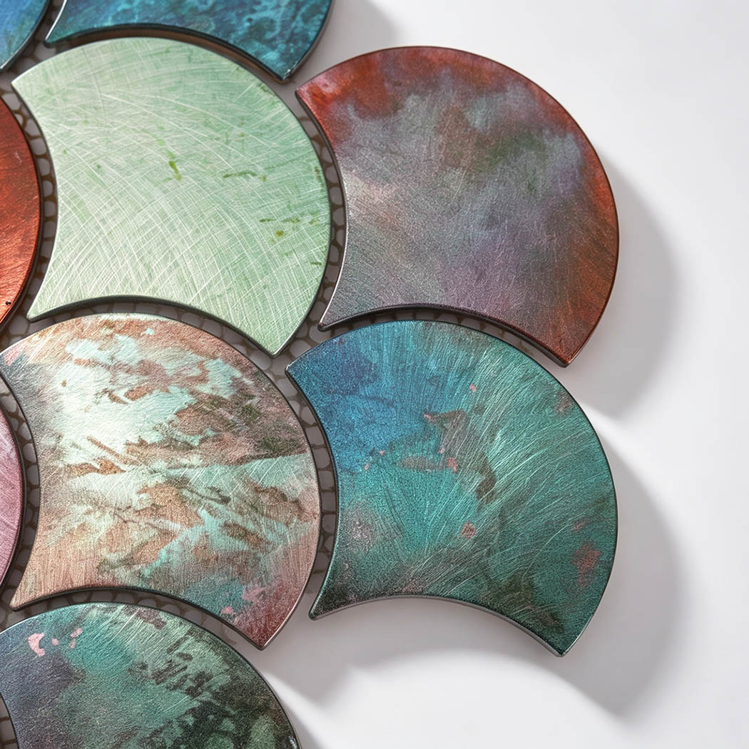 Close-up of colorful fan metal wall tile with brushed distressed finishes
