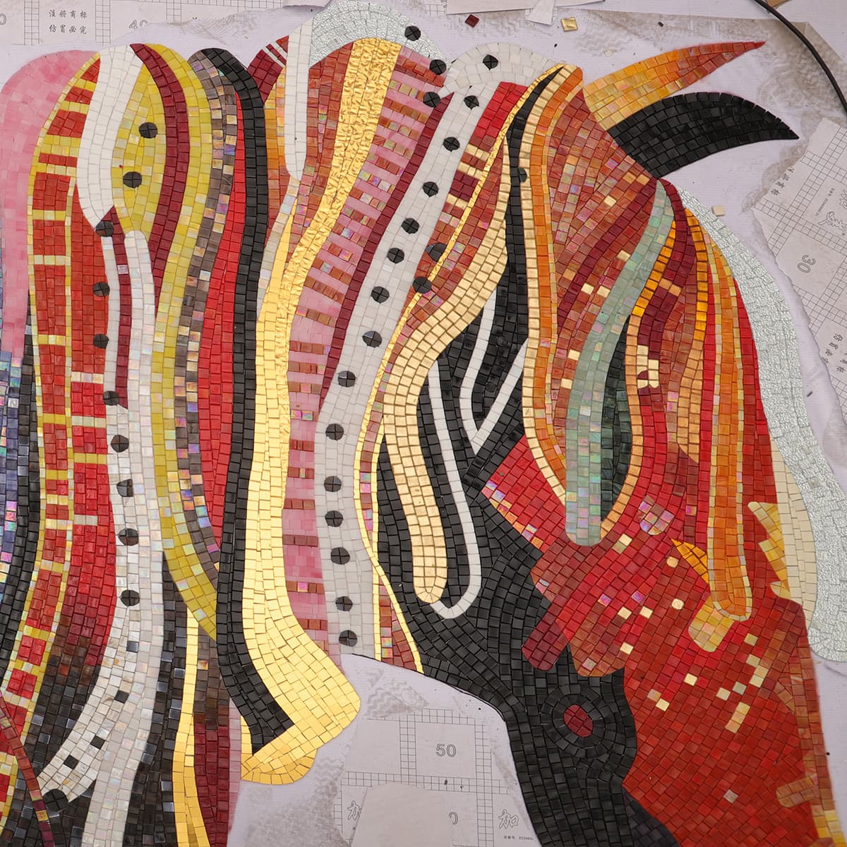 Handcrafted horse mosaic wall mural under construction with colorful tiles