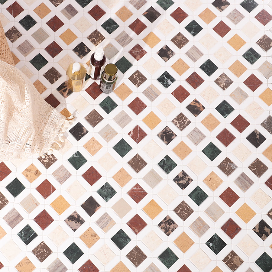 Marble mosaic floor tiles in red green beige and brown tones with lace and bottles