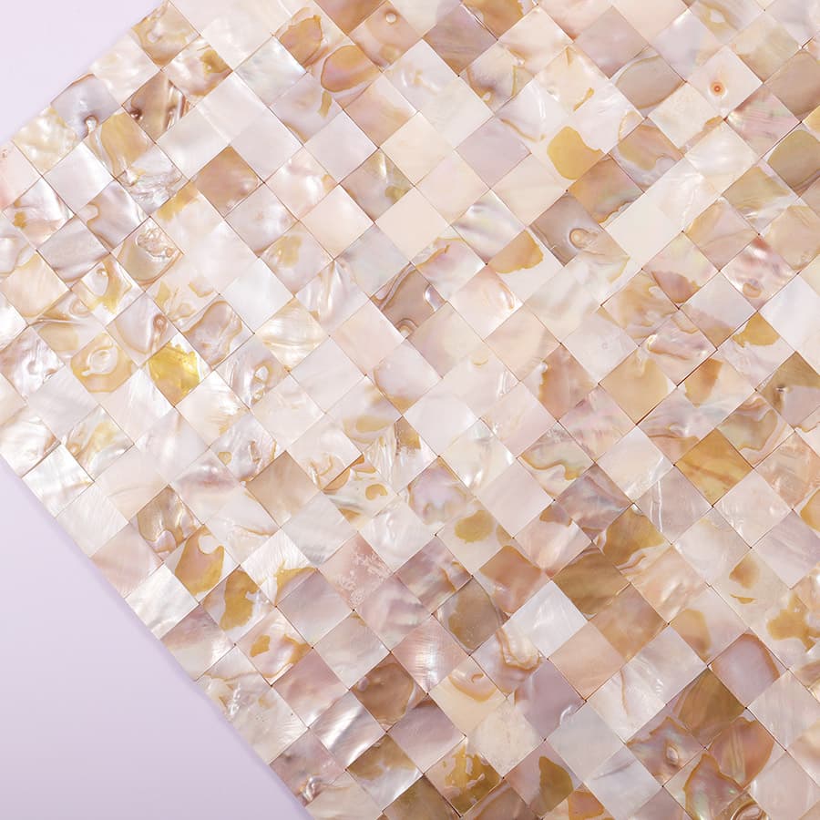 Close-up showing surface texture and vibrant color patterns of shell mosaic