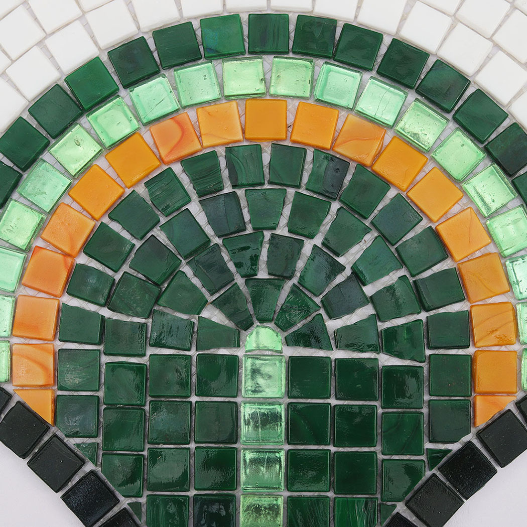 Detailed view of the concentric arch pattern in a mosaic tile.