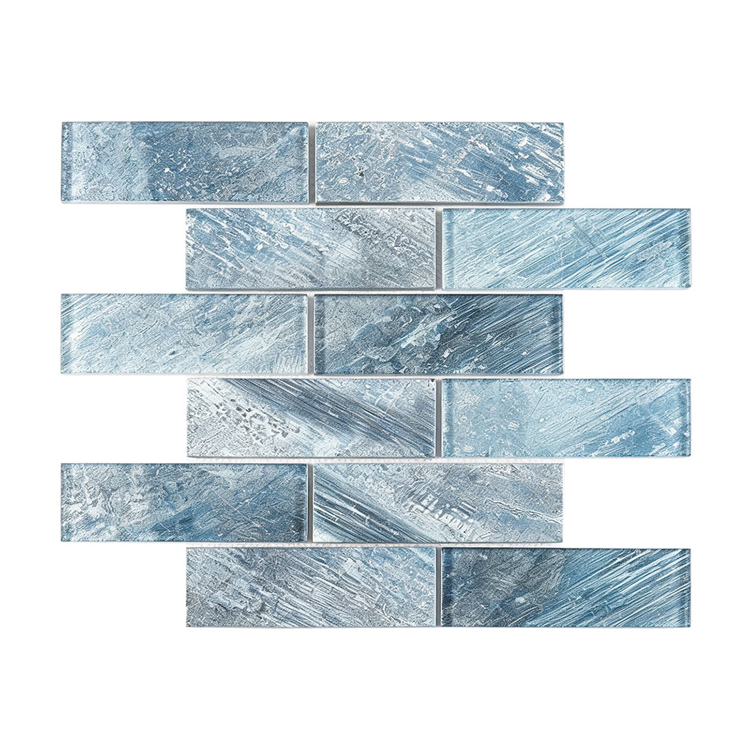 Smooth blue glass subway mosaic with layered brush print pattern on white background