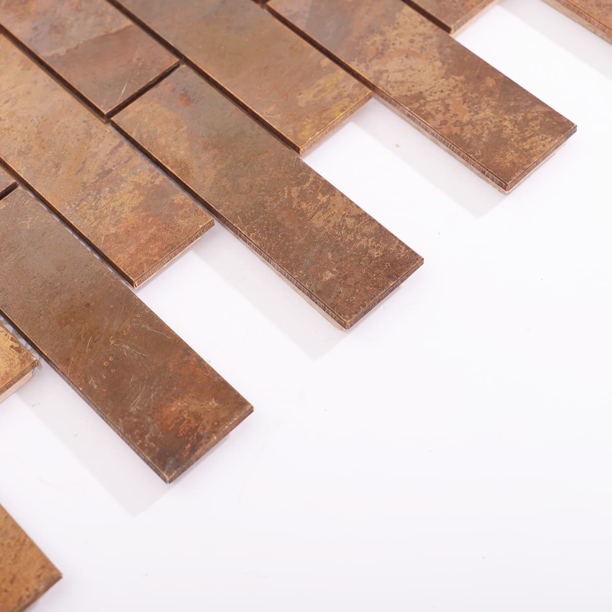 Side flatlay view of rustic copper brick tiles