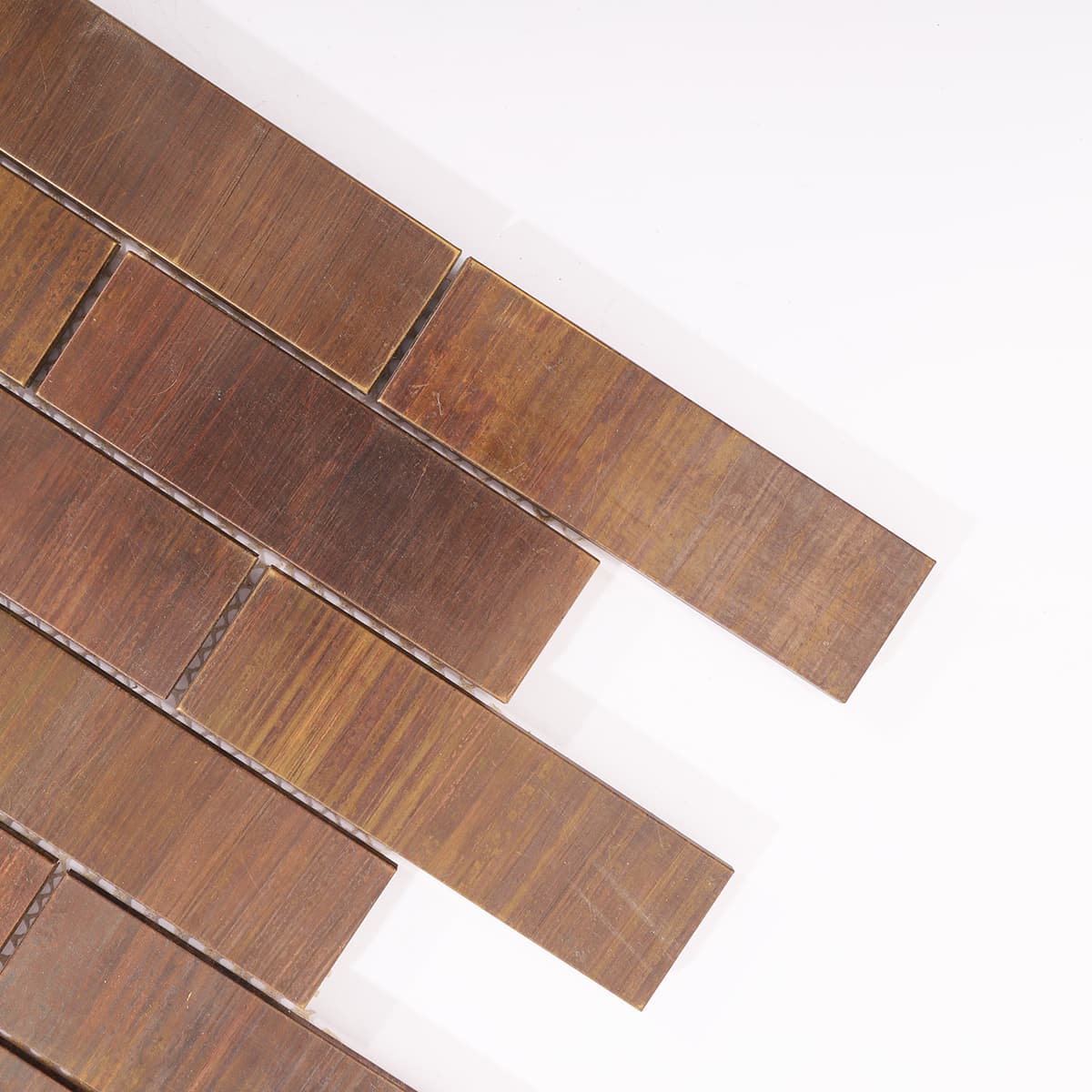 Close-up of copper brick tile corner with rustic texture