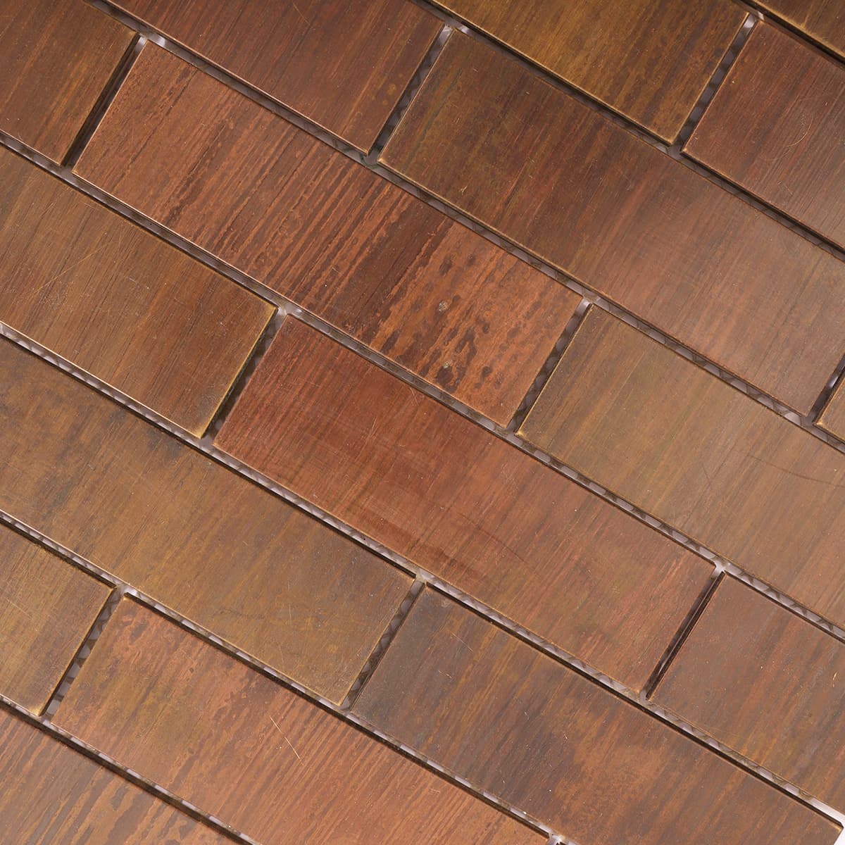 Angled close-up of copper brick tiles with rustic texture